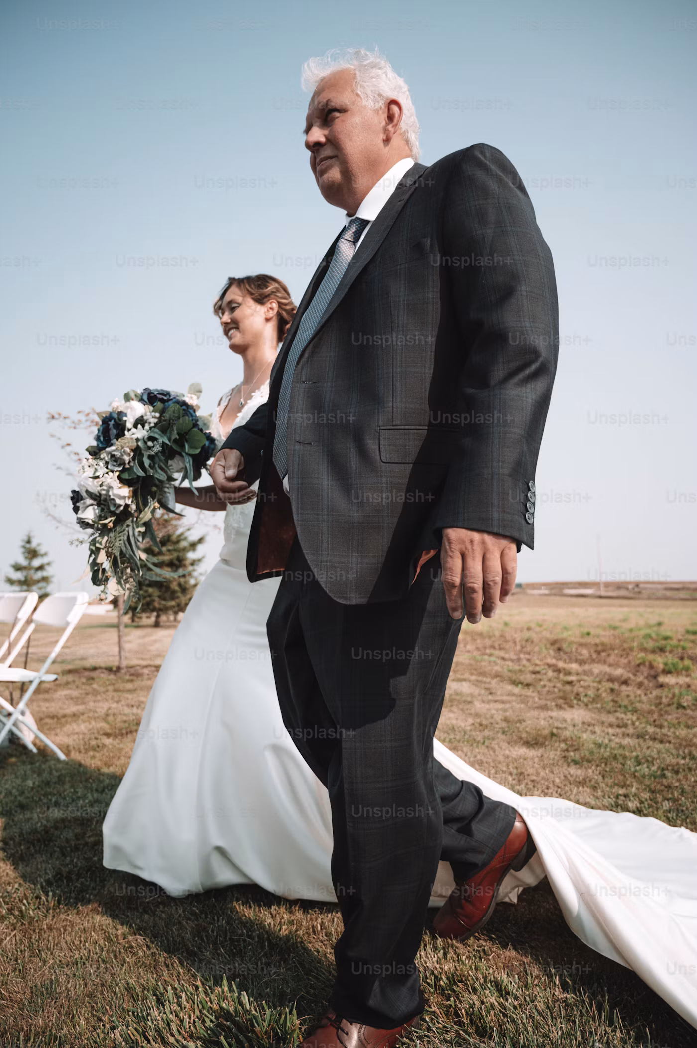 Bride entering an outdoor ceremony